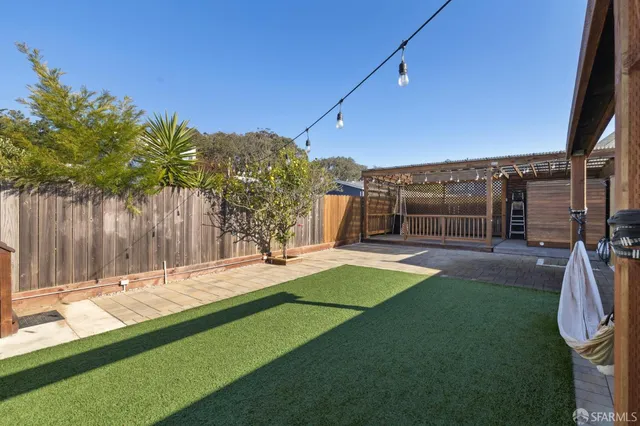 a backyard of a house with lots of green space