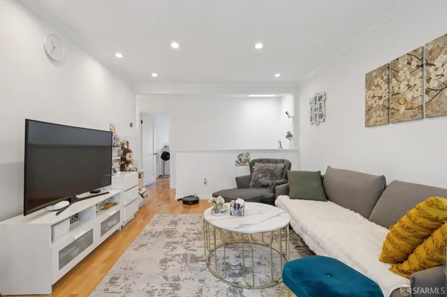 a view of a dining room with furniture and a window