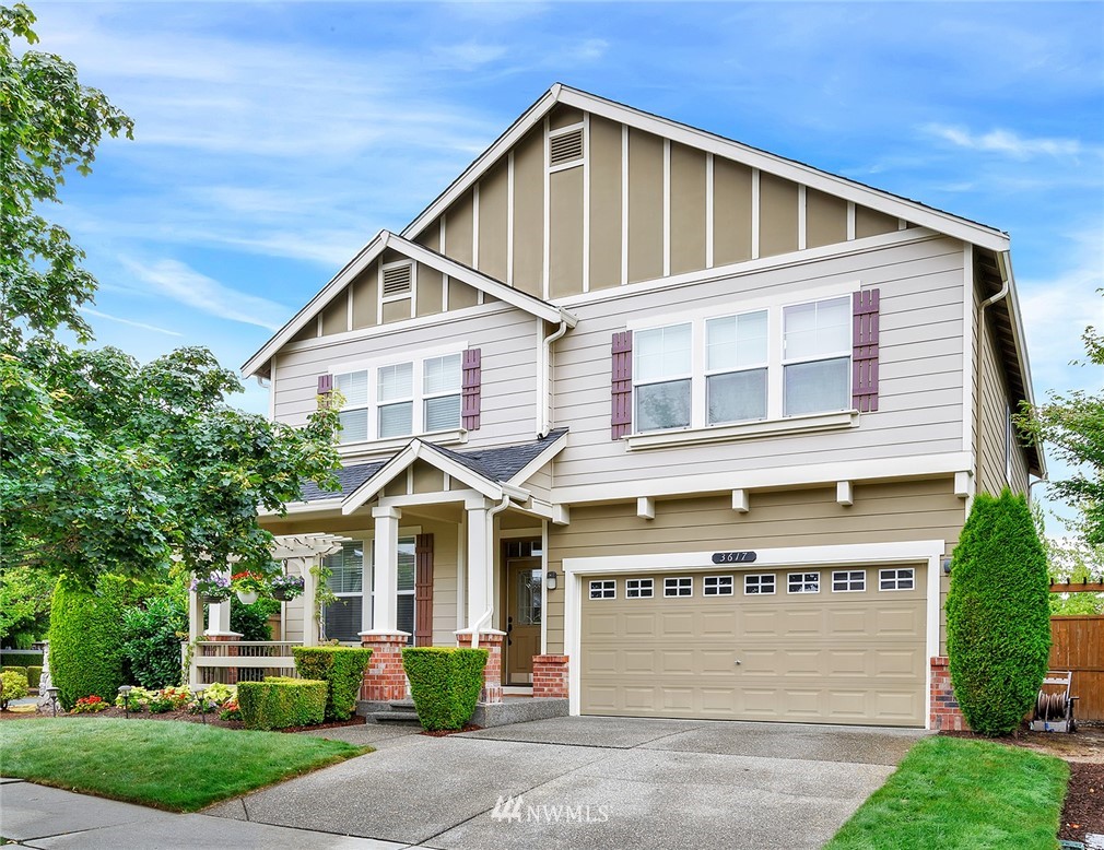 3617 156th Place Southeast Bothell, WA 98012 - Photo 1 of 18 a front view of a house with a yard and garage