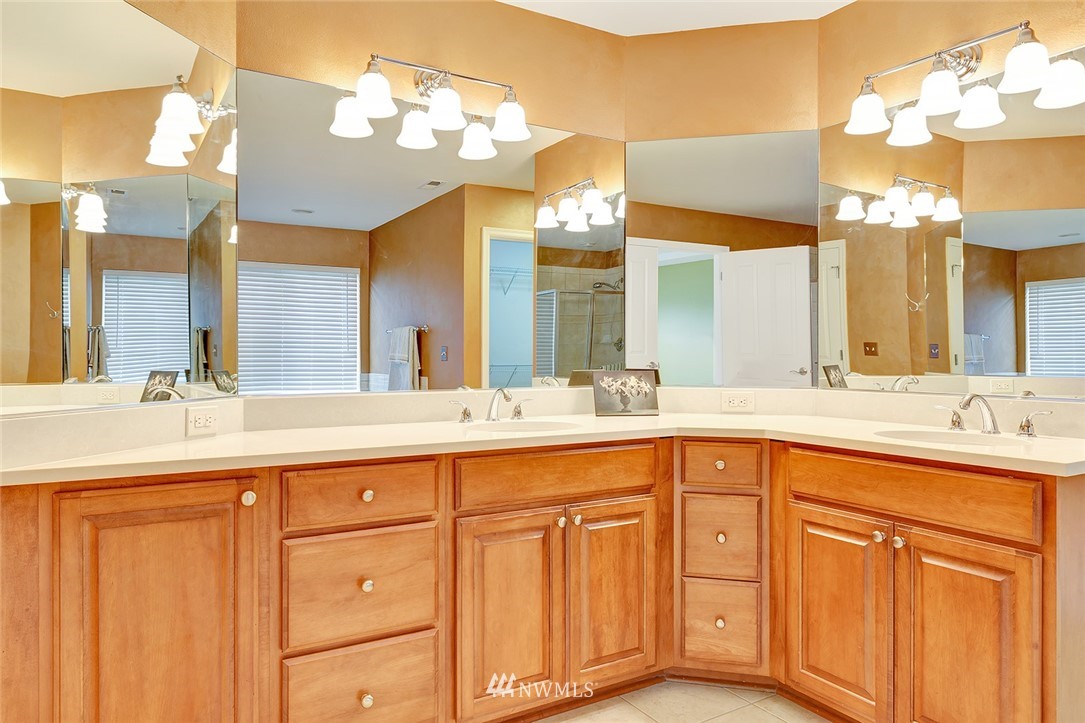 3617 156th Place Southeast Bothell, WA 98012 - Photo 11 of 18 a bathroom with a sink and a large mirror