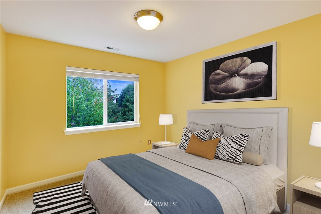 3617 156th Place Southeast Bothell, WA 98012 - Photo 15 of 18 a bedroom with a bed and a painting on the wall