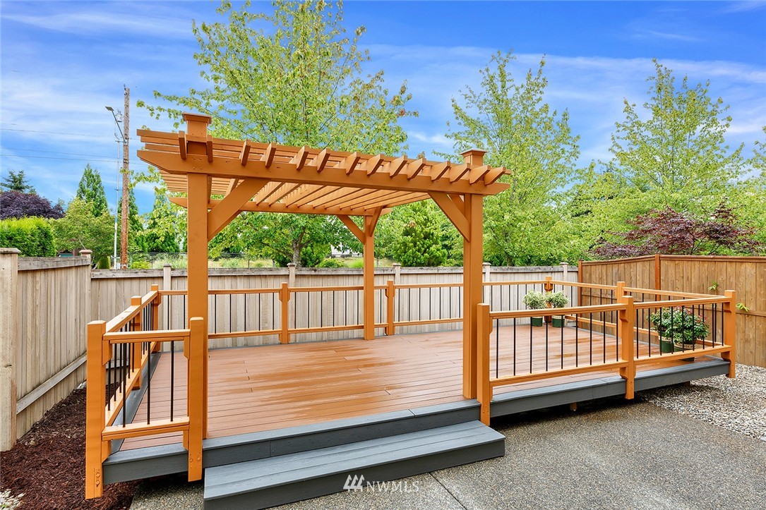 3617 156th Place Southeast Bothell, WA 98012 - Photo 18 of 18 a view of outdoor space with deck and white fence