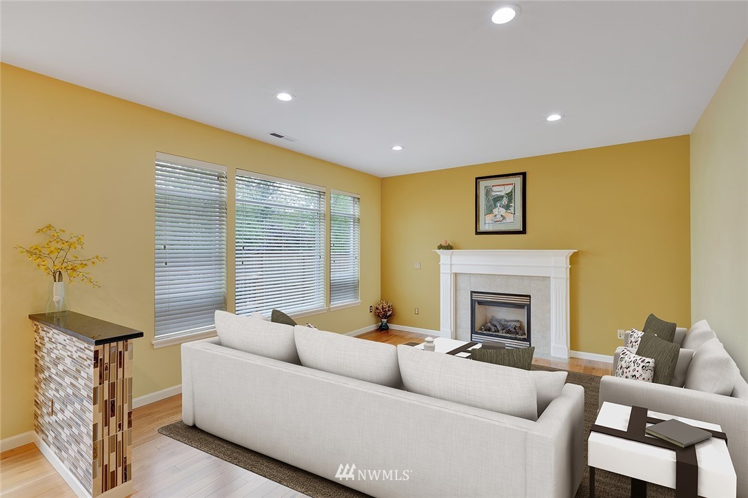3617 156th Place Southeast Bothell, WA 98012 - Photo 7 of 18 a living room with furniture and a fireplace