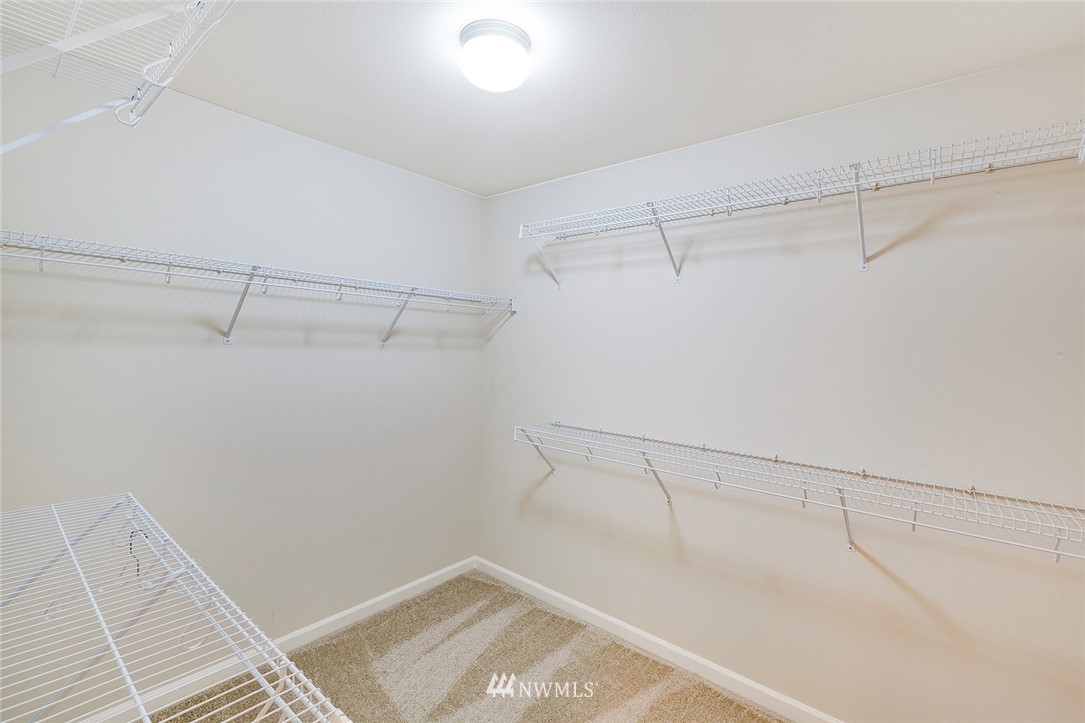 3617 156th Place Southeast Bothell, WA 98012 - Photo 9 of 18 a view of a room with racks on the wall