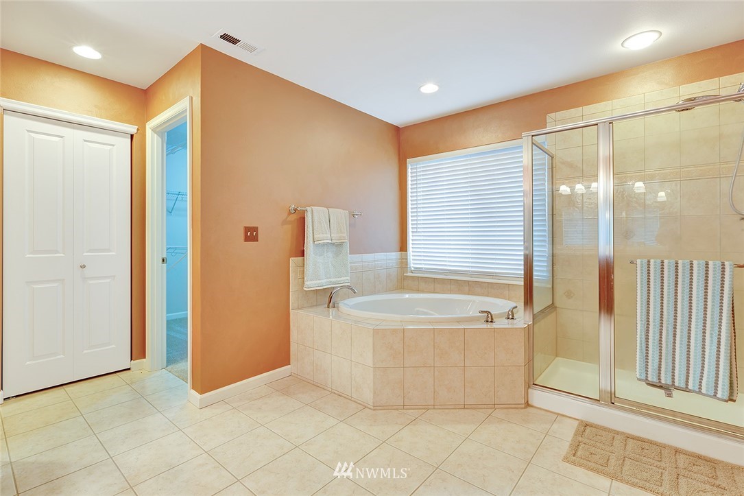 3617 156th Place Southeast Bothell, WA 98012 - Photo 10 of 18 a spacious bathroom with a tub shower and sink