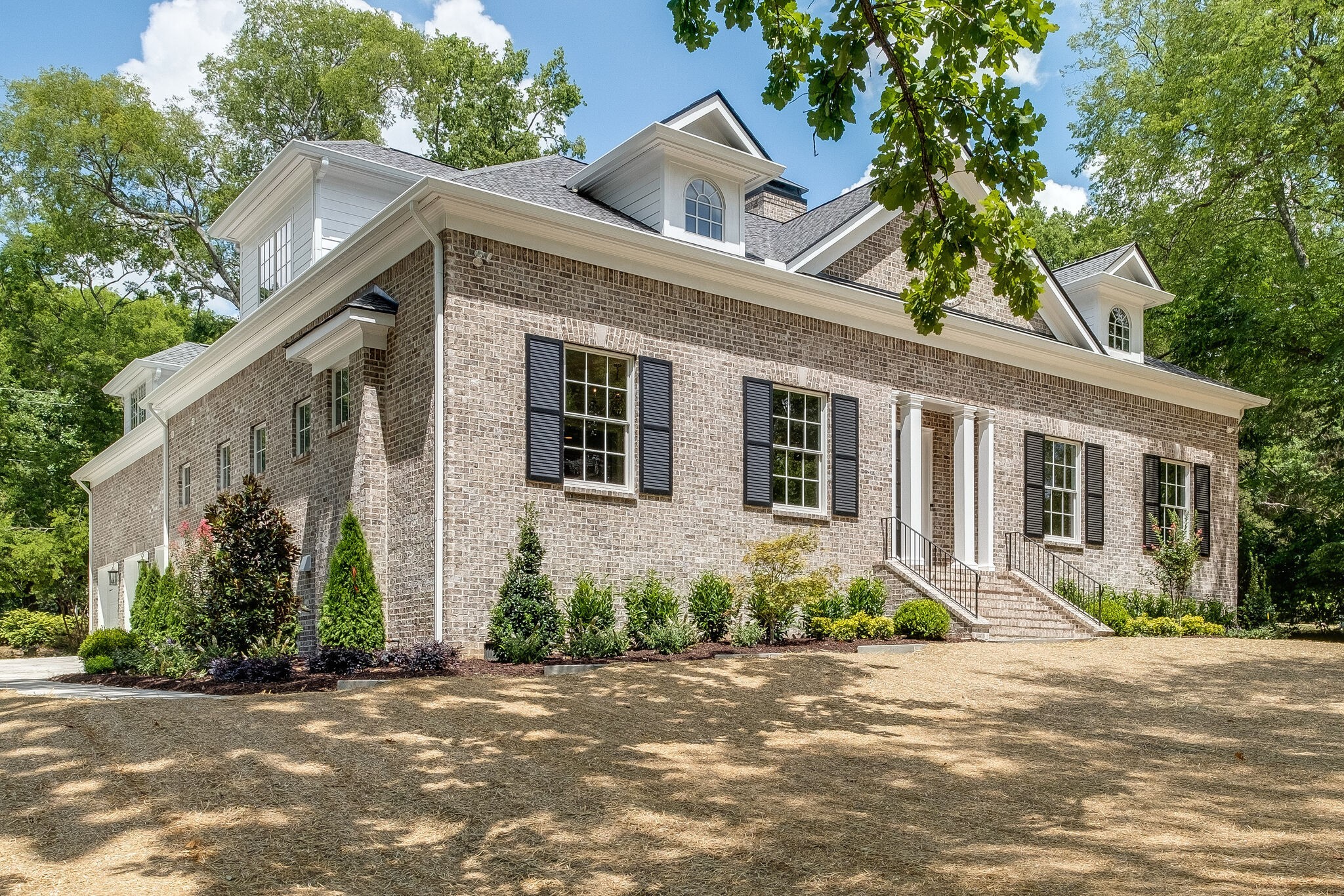 4220 Kirtland Road Nashville, TN 37215 - Photo 2 of 55 a front view of a house with a yard and a garage