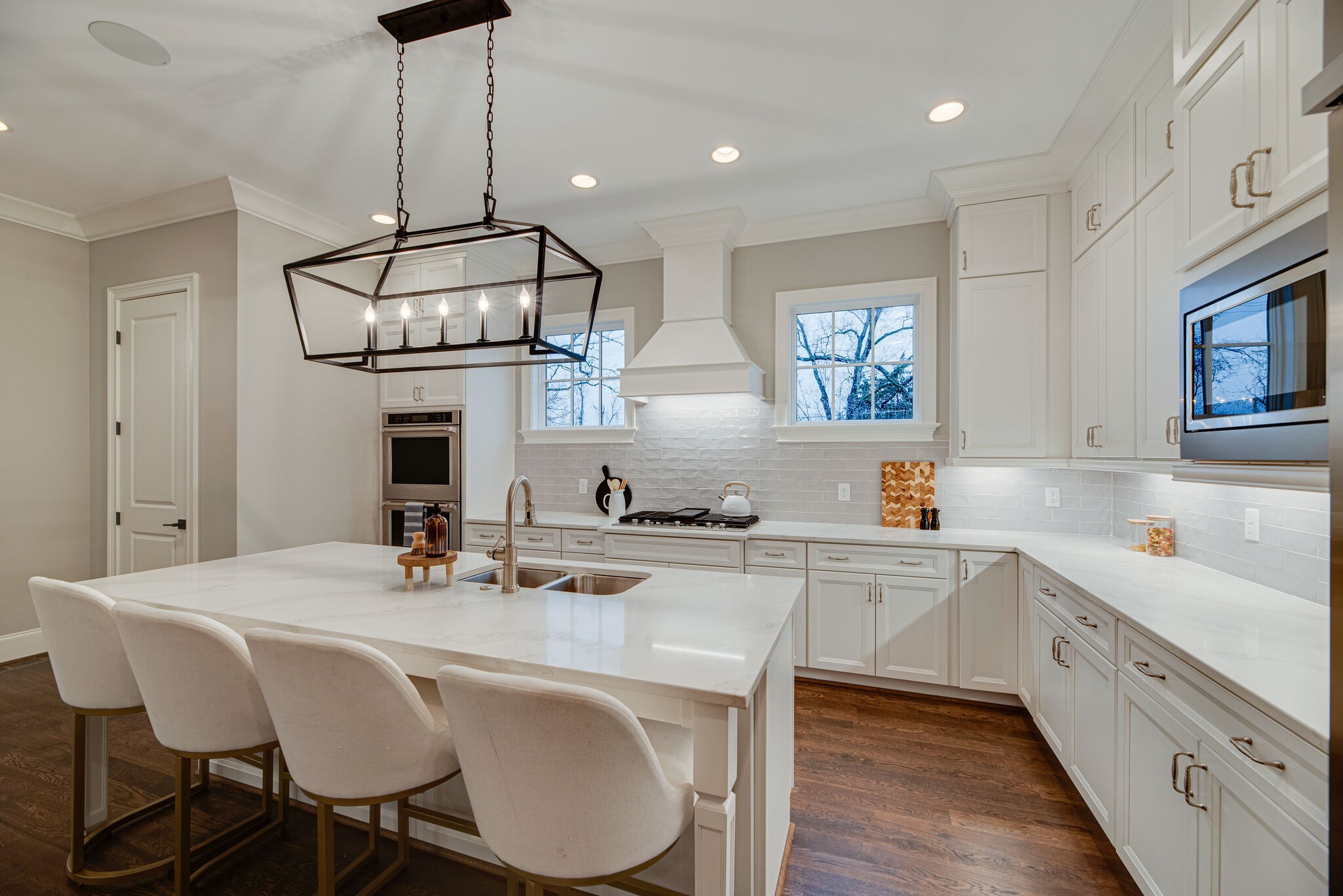 4220 Kirtland Road Nashville, TN 37215 - Photo 22 of 55 a kitchen with stainless steel appliances a center island wooden floor and cabinets