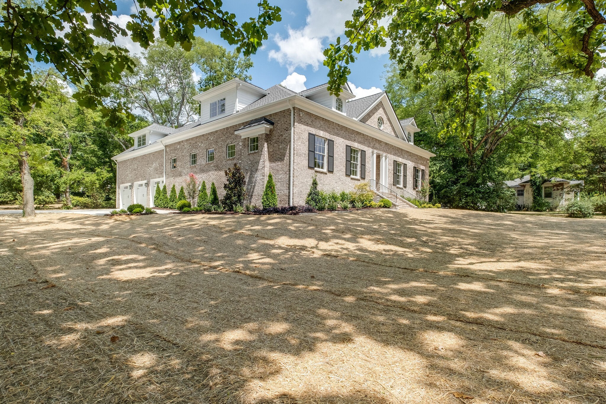 4220 Kirtland Road Nashville, TN 37215 - Photo 3 of 55 a front view of a house with a garden