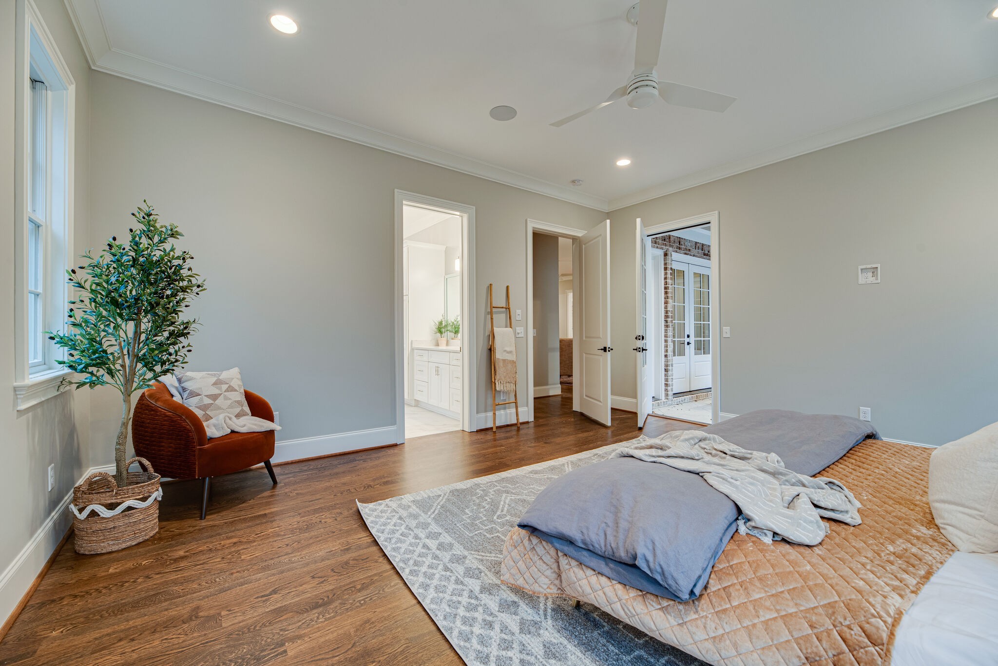 4220 Kirtland Road Nashville, TN 37215 - Photo 31 of 55 a spacious bedroom with a bed a couch and a potted plant