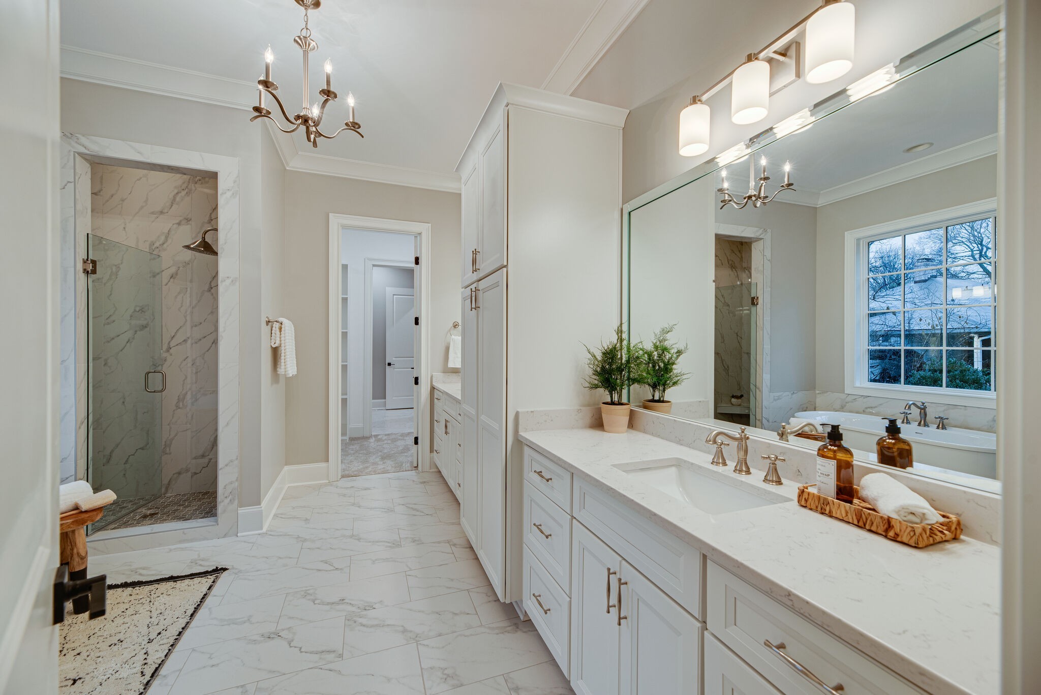 4220 Kirtland Road Nashville, TN 37215 - Photo 32 of 55 a bathroom with a double vanity sink mirror and shower