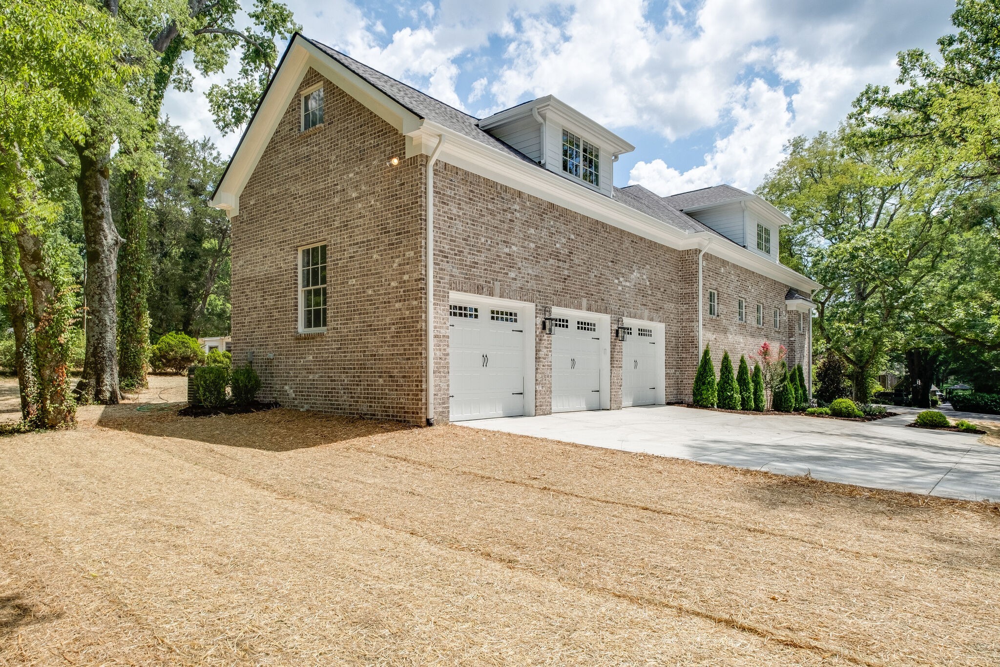 4220 Kirtland Road Nashville, TN 37215 - Photo 48 of 55 a front view of a house with a yard and garage