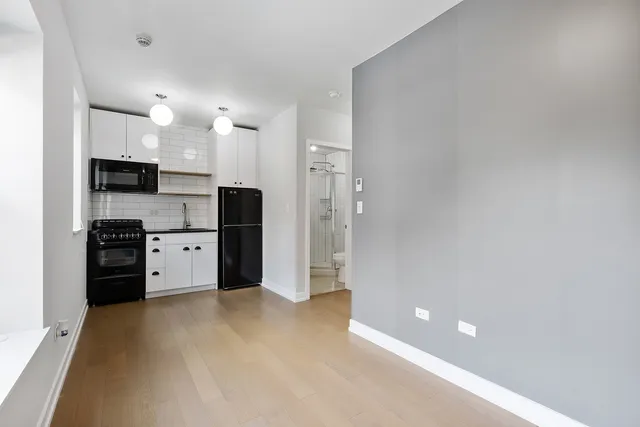 a kitchen with stainless steel appliances a refrigerator and a sink