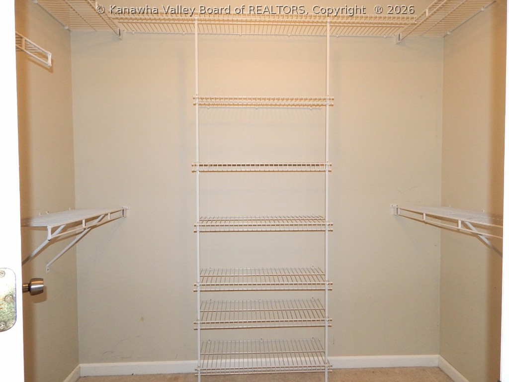 349 Bluelick Road Winfield, WV 25213 - Photo 16 of 28 MASTER WALK IN WITH SHELVING.
