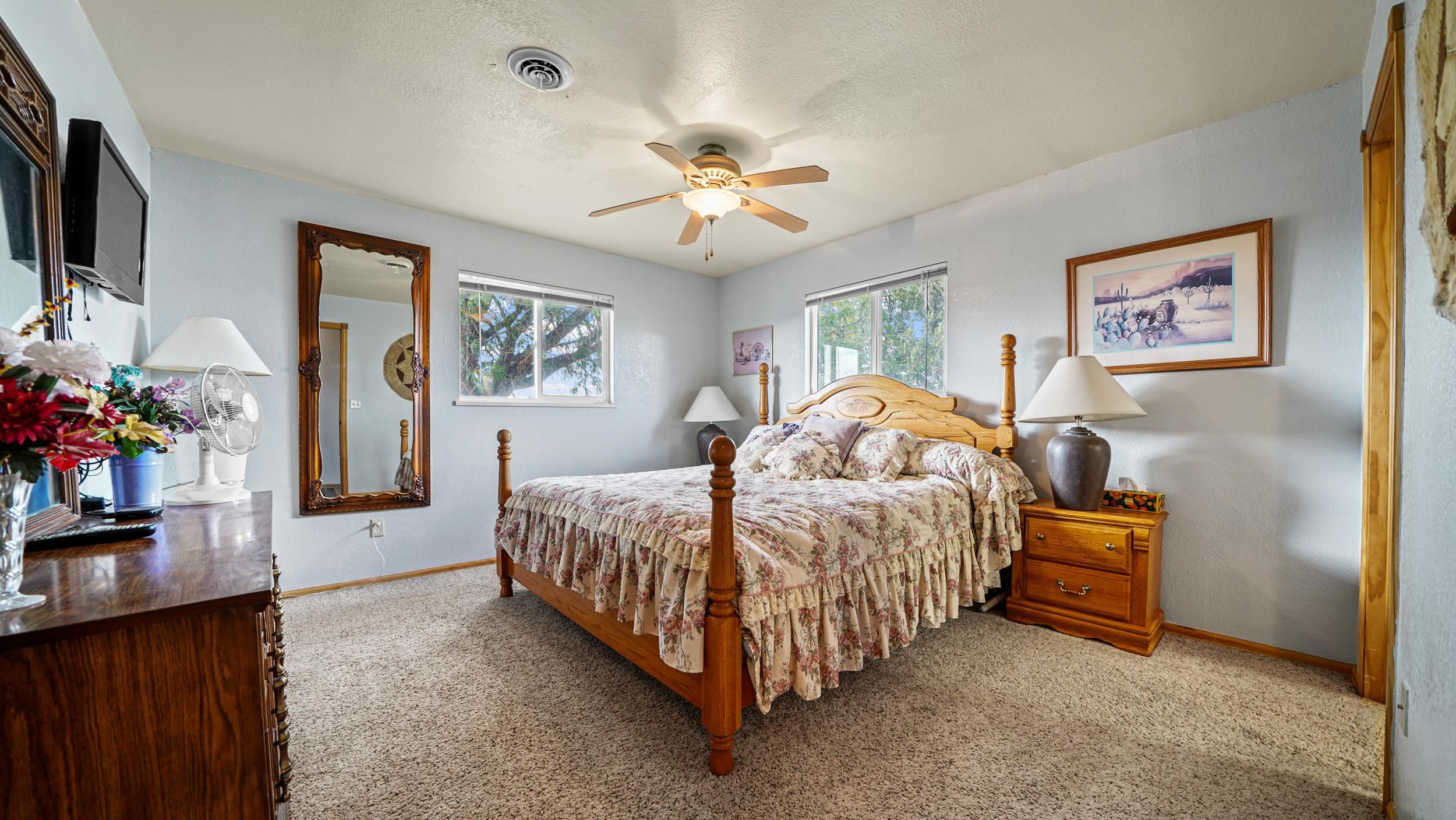 20786 Iris Road Austin, CO 81410 - Photo 23 of 38 a bed room with a bed and a chandelier
