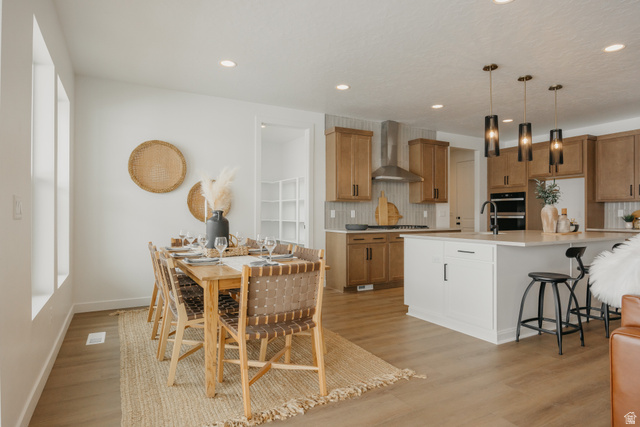 1066n South State Road, Unit ATWOOD Salem, UT 84653 - Photo 19 of 29 Open-concept design featuring wood-finish flooring, recessed lighting, and a kitchen island with pendant lighting