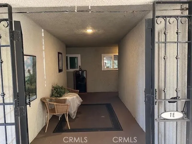 a view of a hallway and dining room
