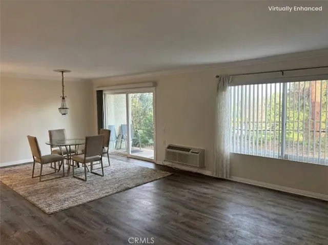 a view of a dining room with furniture and windows