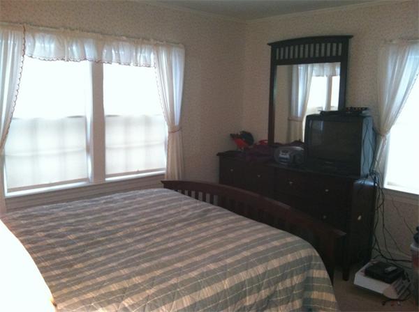 36 Downfall Road Newbury, MA 01922 - Photo 11 of 15 a bedroom with a bed and a large window