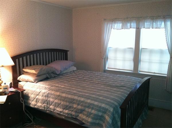 36 Downfall Road Newbury, MA 01922 - Photo 12 of 15 a bed sitting in a bedroom next to a window