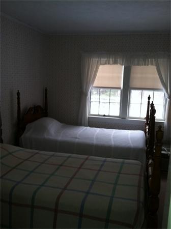 36 Downfall Road Newbury, MA 01922 - Photo 14 of 15 a bedroom with a bed and a window