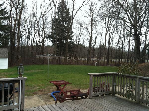 36 Downfall Road Newbury, MA 01922 - Photo 4 of 15 a view of a wooden deck and a yard