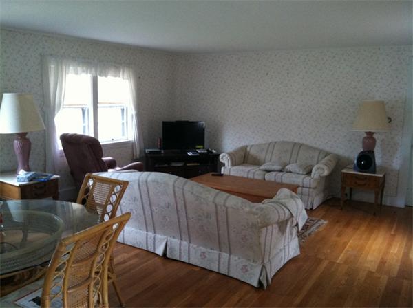 36 Downfall Road Newbury, MA 01922 - Photo 5 of 15 a bedroom with a bed and wooden floor