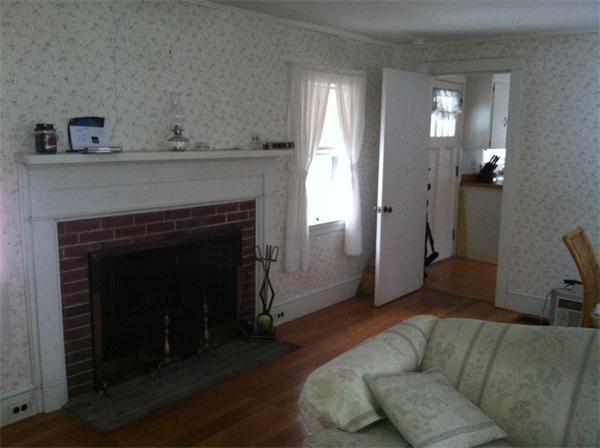 36 Downfall Road Newbury, MA 01922 - Photo 6 of 15 a living room with furniture and a fireplace