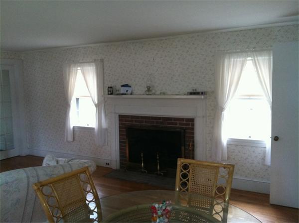 36 Downfall Road Newbury, MA 01922 - Photo 7 of 15 a living room with furniture and a fireplace