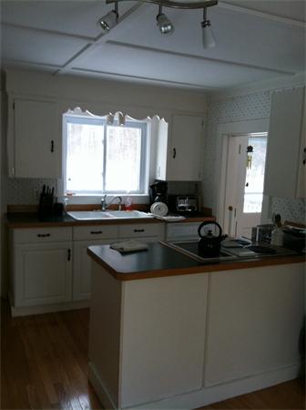 36 Downfall Road Newbury, MA 01922 - Photo 8 of 15 a kitchen with a sink and a window