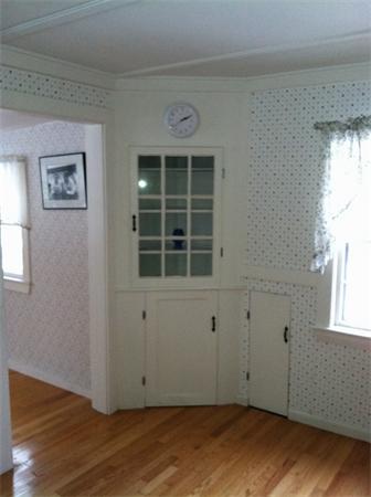 36 Downfall Road Newbury, MA 01922 - Photo 10 of 15 an empty room with wooden floor and windows