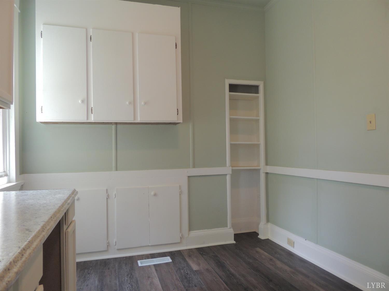 7007 Wards Road Rustburg, VA 24588 - Photo 11 of 26 a view of cabinets and wooden floor