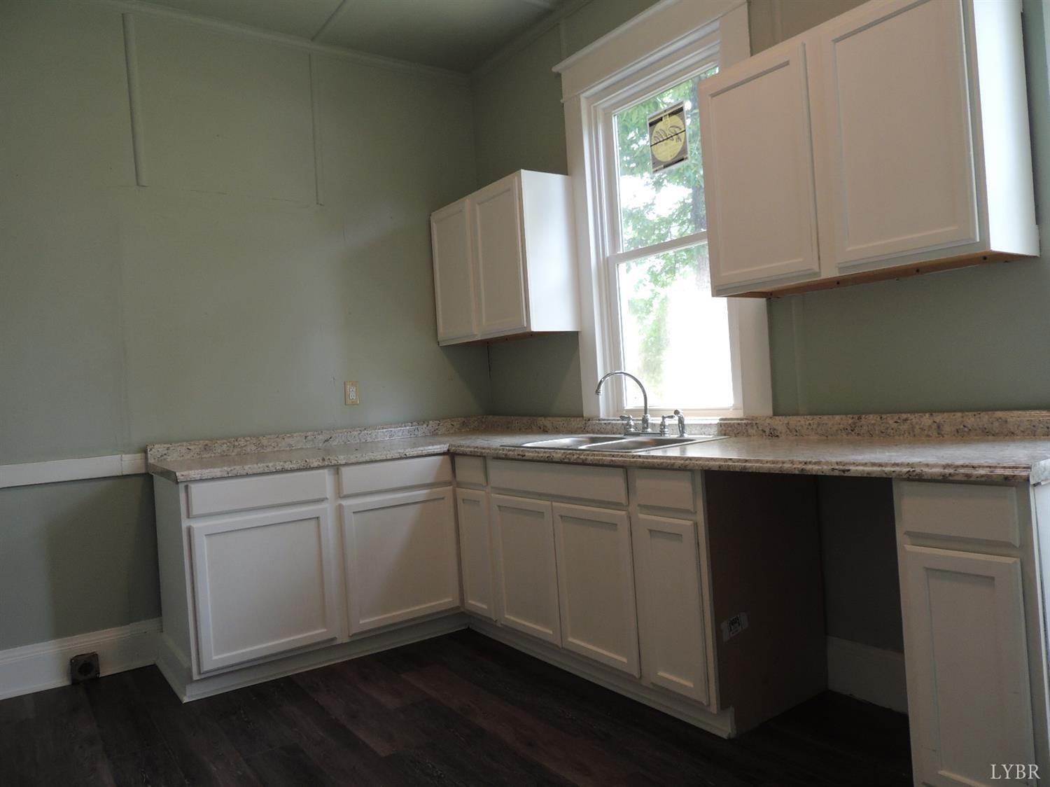 7007 Wards Road Rustburg, VA 24588 - Photo 10 of 26 a kitchen with a sink cabinets and window