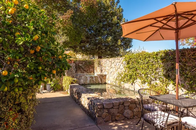 a view of yard with patio