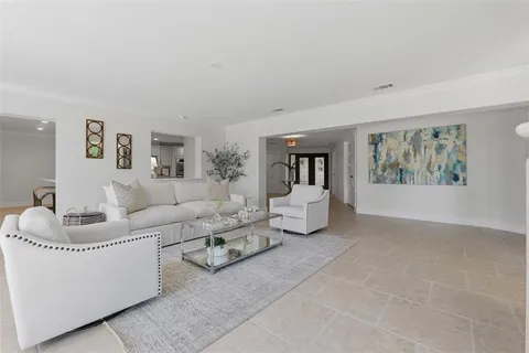 a view of a living room and entryway