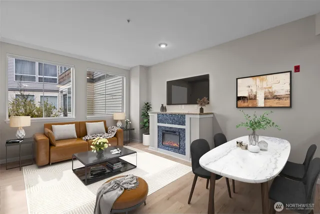 a living room with furniture a fireplace and a flat screen tv