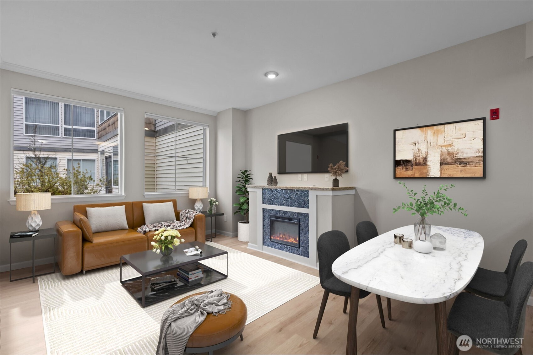 a living room with furniture a fireplace and a flat screen tv