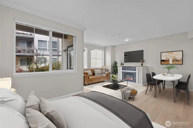 a living room with furniture a fireplace and windows