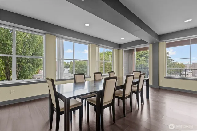 a view of a dining room with furniture and windows