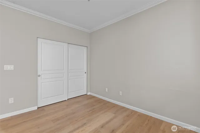 a view of a livingroom with an empty space and a window
