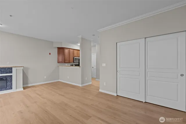 a kitchen with a stove a sink and a microwave