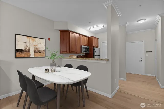a view of a dining room with furniture and wooden floor