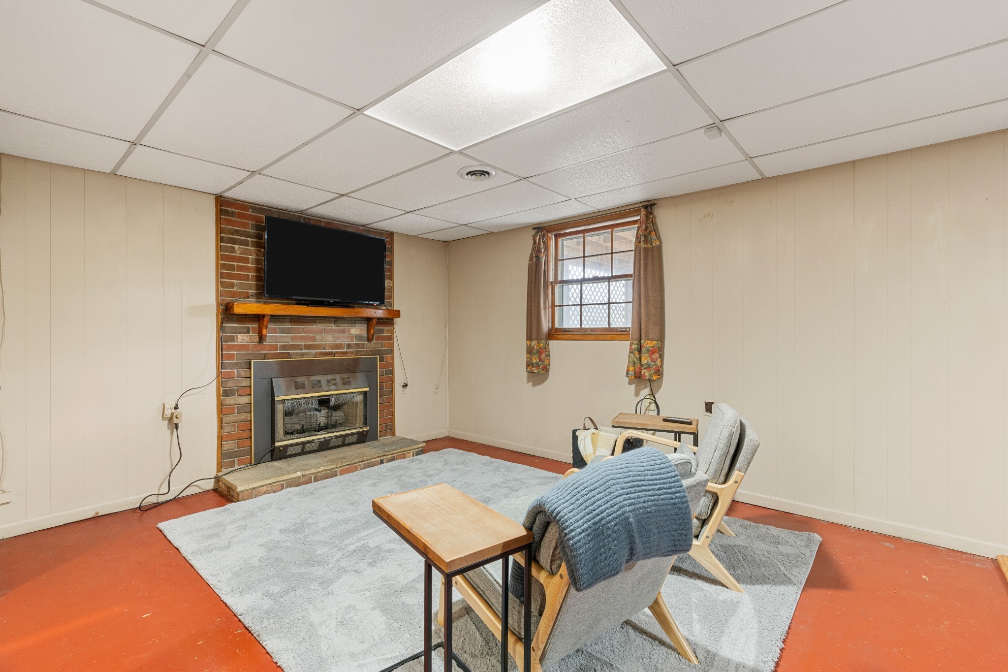 612 Canton Pass Madison, TN 37115 - Photo 15 of 24 a living room with furniture a flat screen tv and a fireplace
