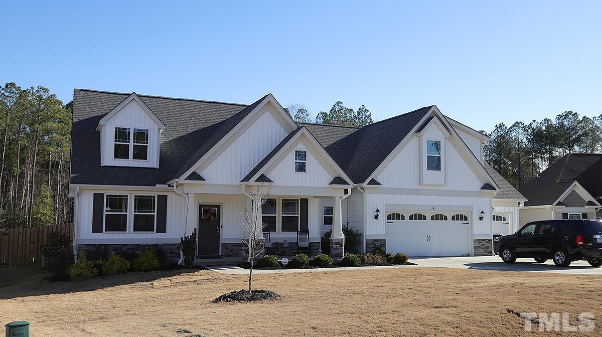 74 Flora Drive Benson, NC 27504 - Photo 1 of 33 a front view of a house with a yard