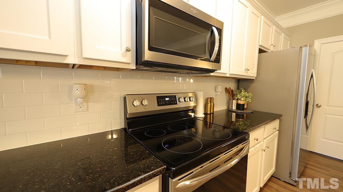 74 Flora Drive Benson, NC 27504 - Photo 13 of 33 a kitchen with a stove microwave and refrigerator