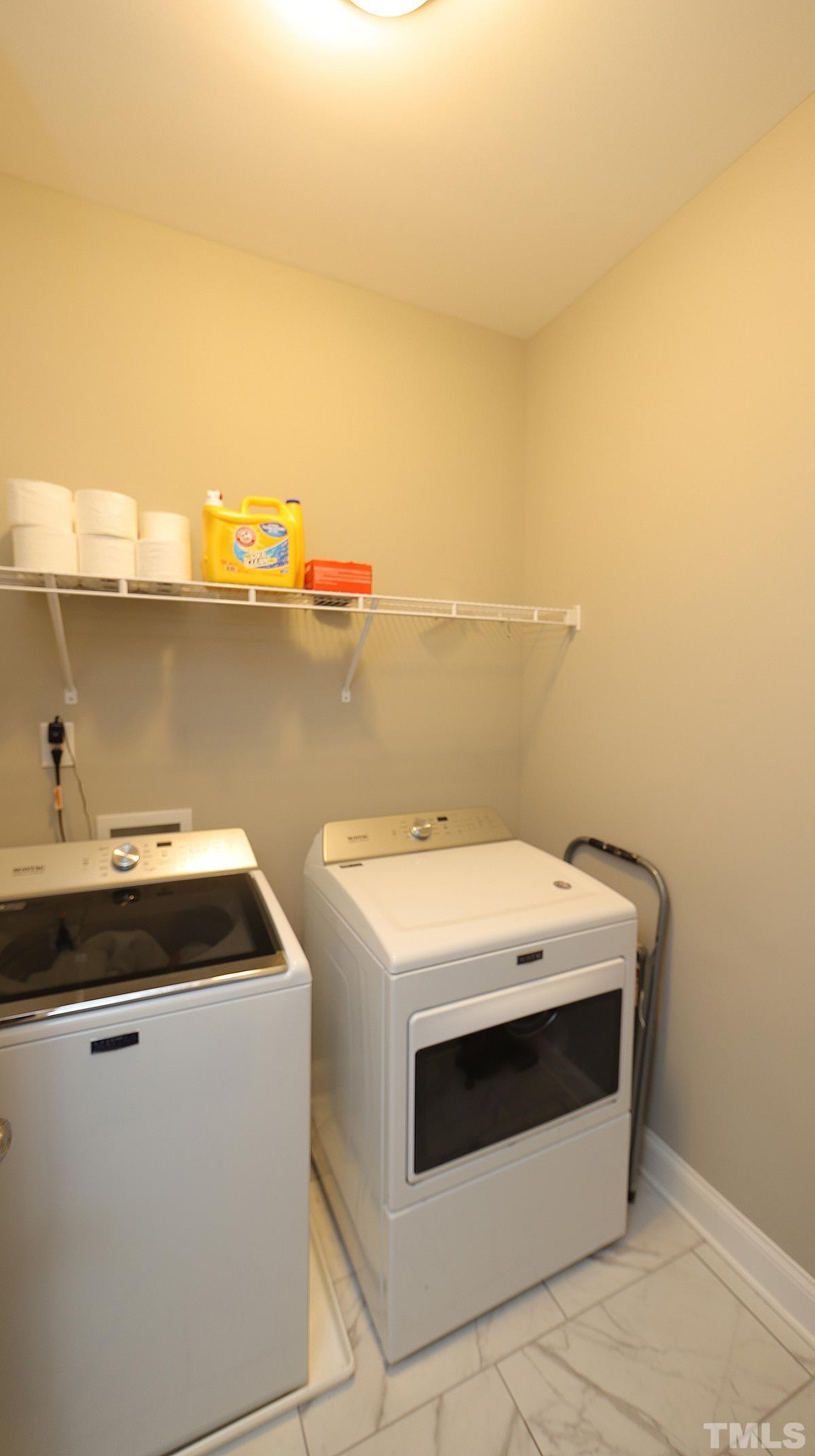 74 Flora Drive Benson, NC 27504 - Photo 22 of 33 a utility room with dryer and washer