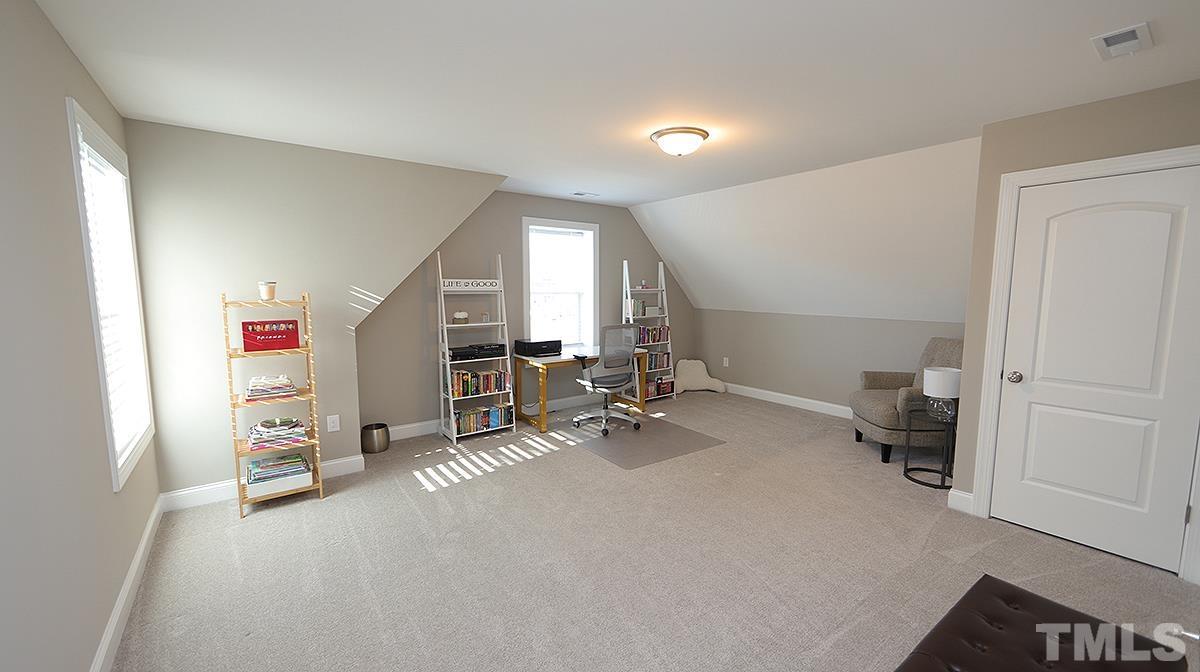 74 Flora Drive Benson, NC 27504 - Photo 27 of 33 a view of a livingroom with furniture and a window