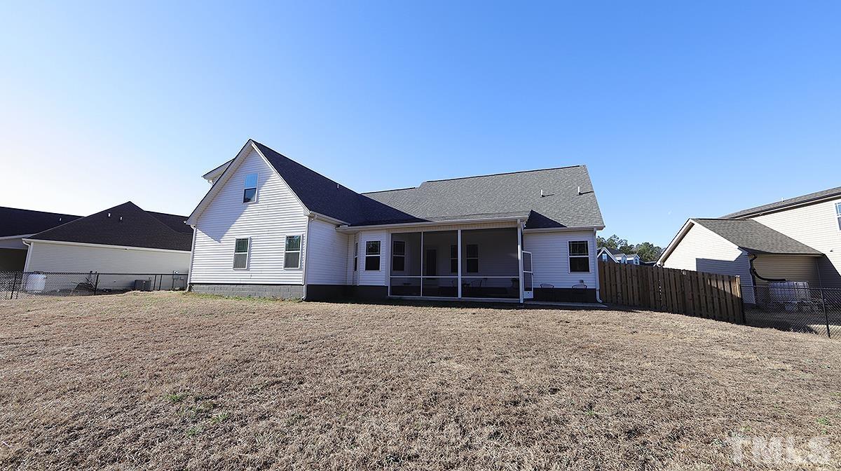 74 Flora Drive Benson, NC 27504 - Photo 32 of 33 a view of a house with a yard