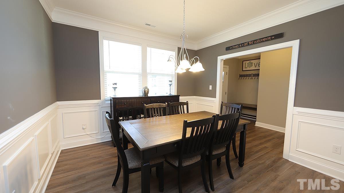 74 Flora Drive Benson, NC 27504 - Photo 5 of 33 a view of a dining room with furniture window and wooden floor
