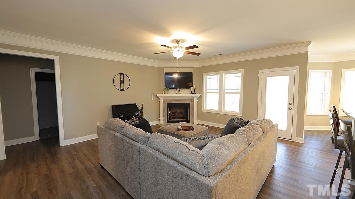 74 Flora Drive Benson, NC 27504 - Photo 6 of 33 a living room with furniture fireplace and flat screen tv