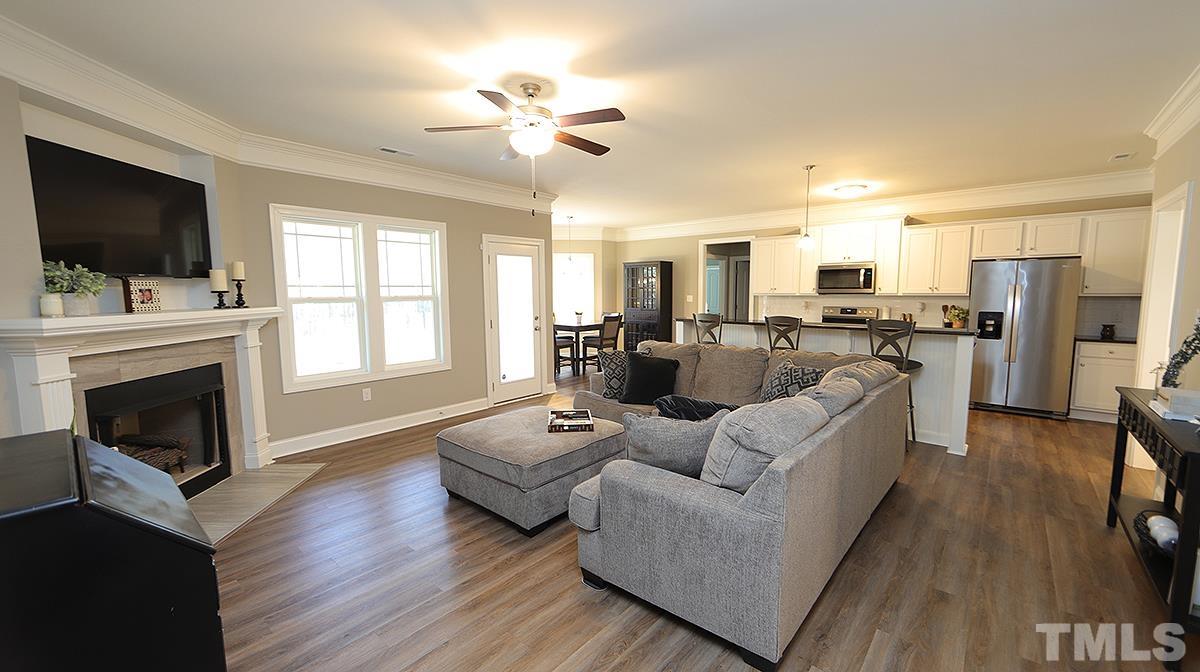 74 Flora Drive Benson, NC 27504 - Photo 7 of 33 a living room with furniture fireplace and flat screen tv